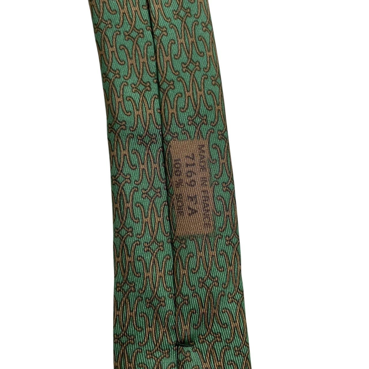 Hermes green silk tie with subtle sheen and logo detailing.