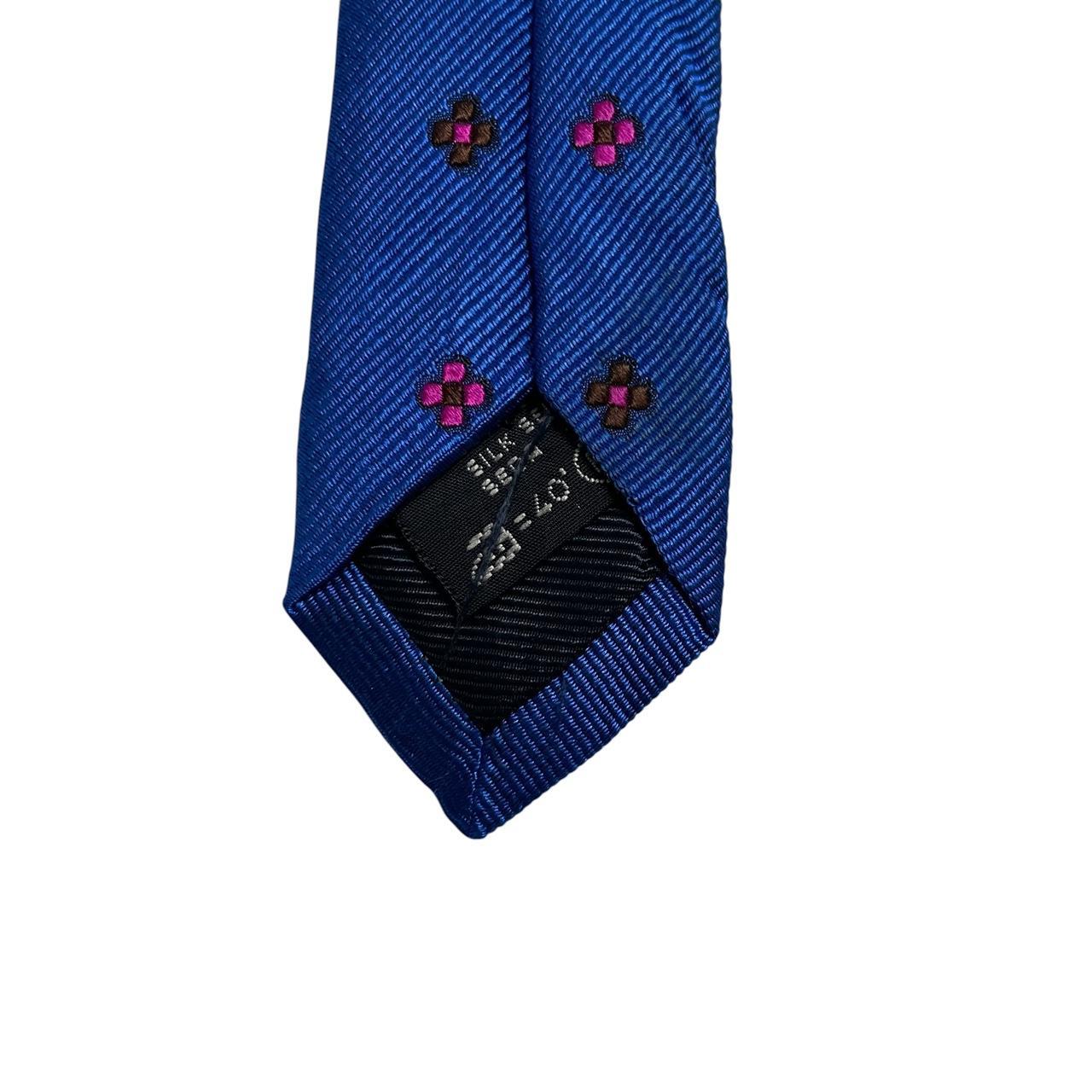 Ermenegildo Zegna blue silk tie with subtle sheen and classic design.