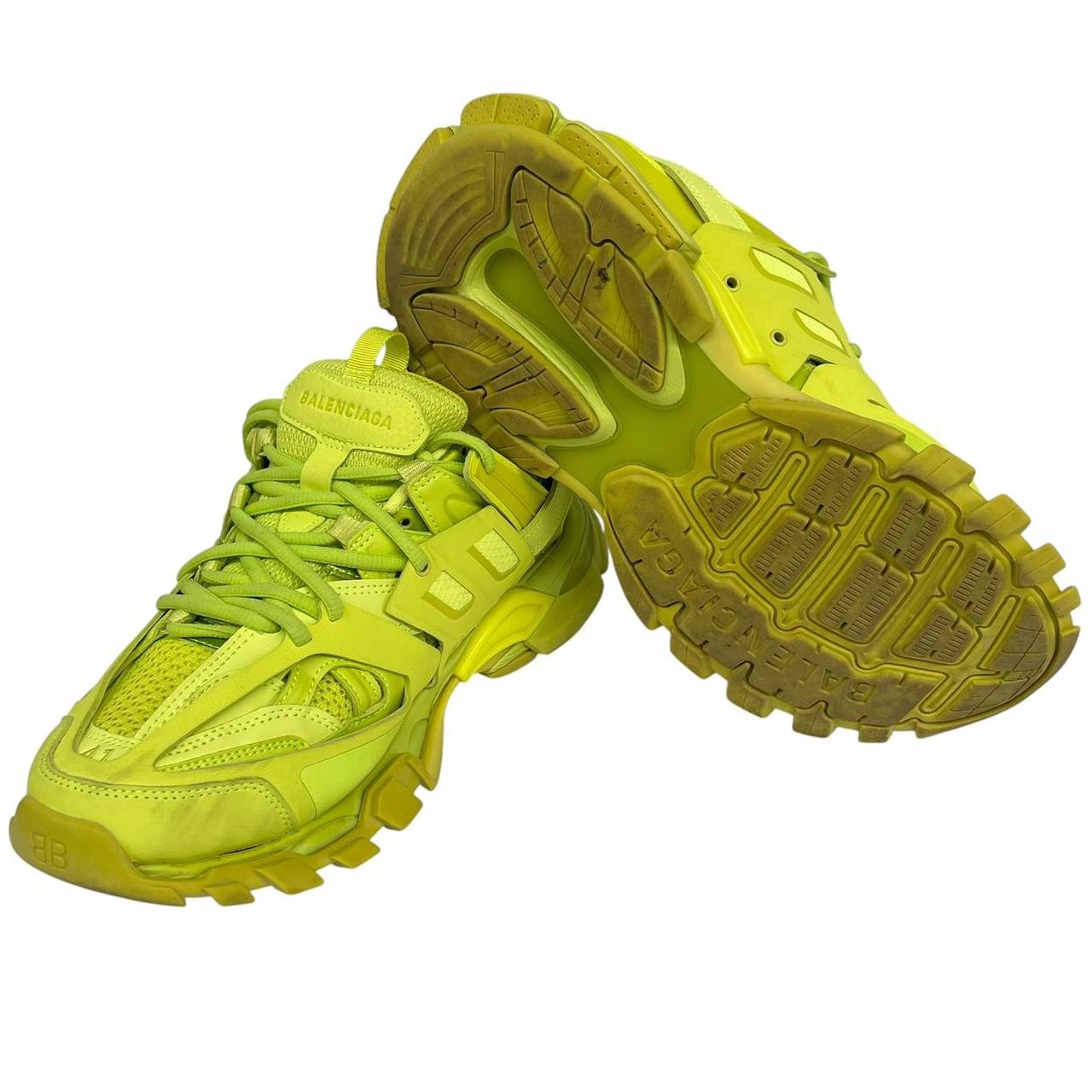 Balenciaga green low top trainers with logo detailing and textured mesh upper.