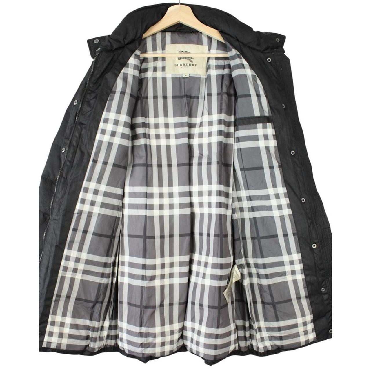 Burberry black puffer coat with Nova Check pattern and belted waist detail.