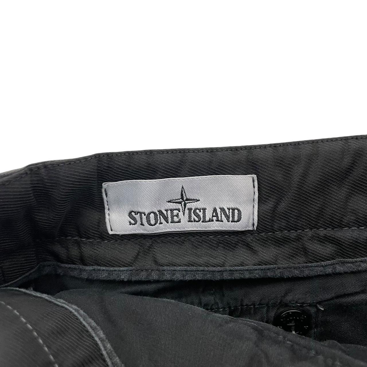Stone Island black skinny fit cargo trousers with logo patch and multiple pockets.