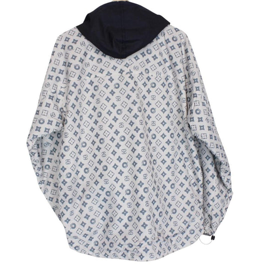 Stüssy reversible nylon jacket in grey and navy blue with logo detailing.
