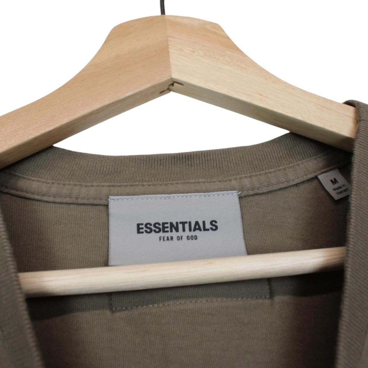 Essentials khaki brown short sleeve t-shirt with logo print and pocket detail.