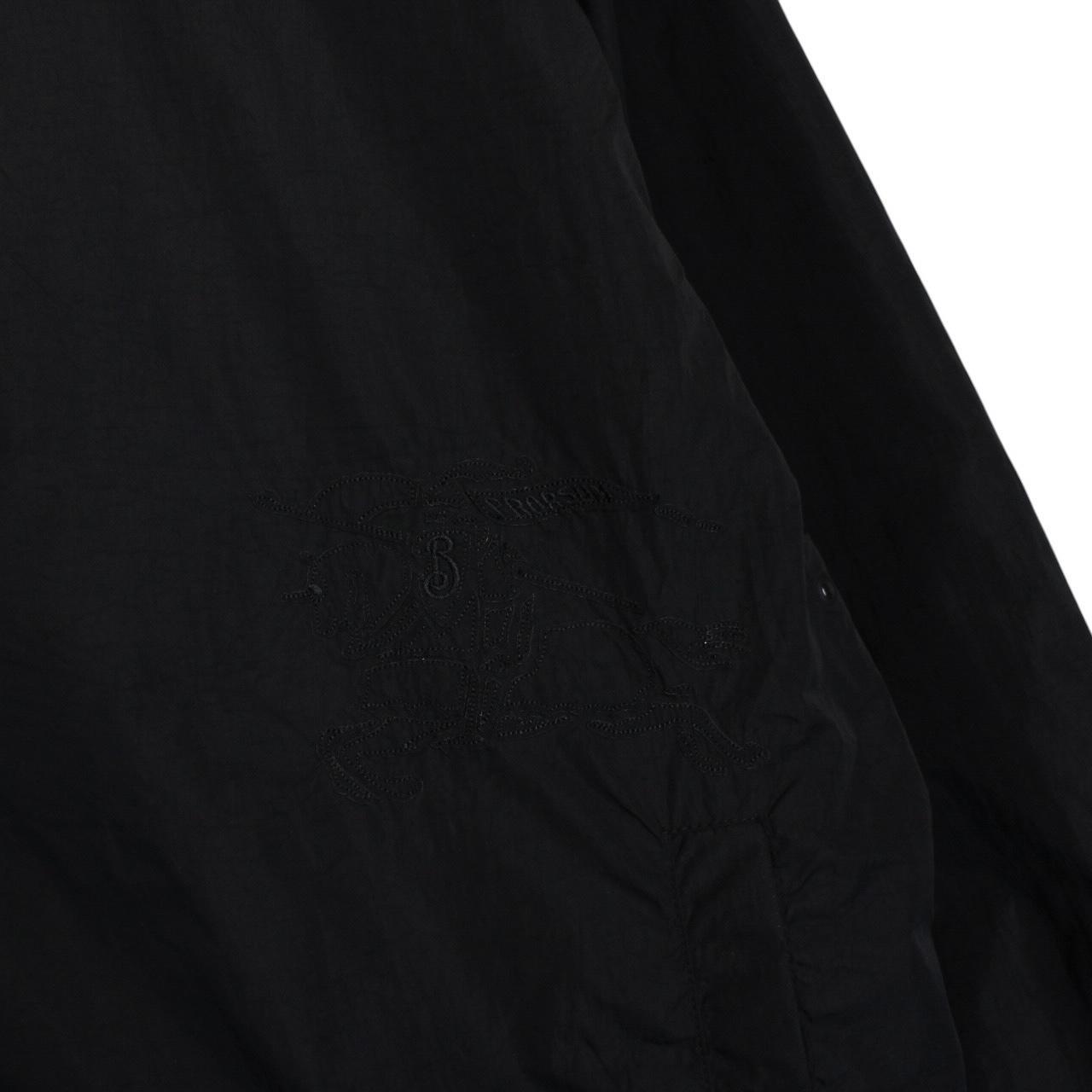 Burberry reversible jacket in dark grey and black with Nova Check pattern and full zip.
