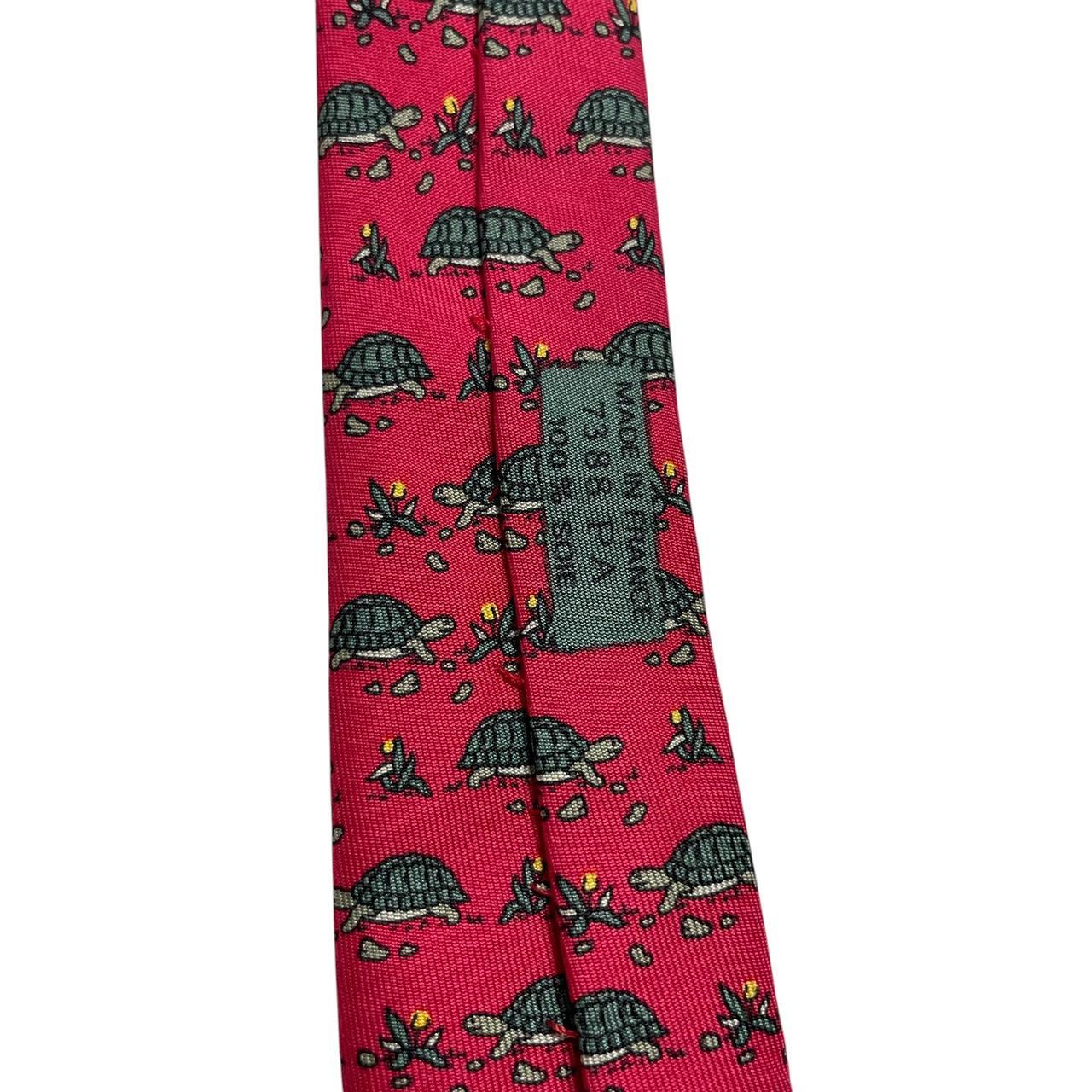 Hermes green and red silk tie featuring turtle print design and logo.