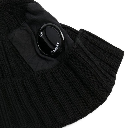 CP Company black beanie hat made of extra fine merino wool with side lens detail.