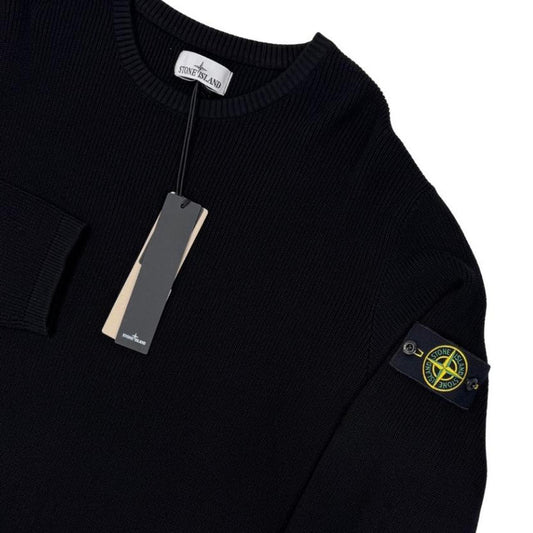 Stone Island black ribbed knit jumper with logo badge and organic cotton material.
