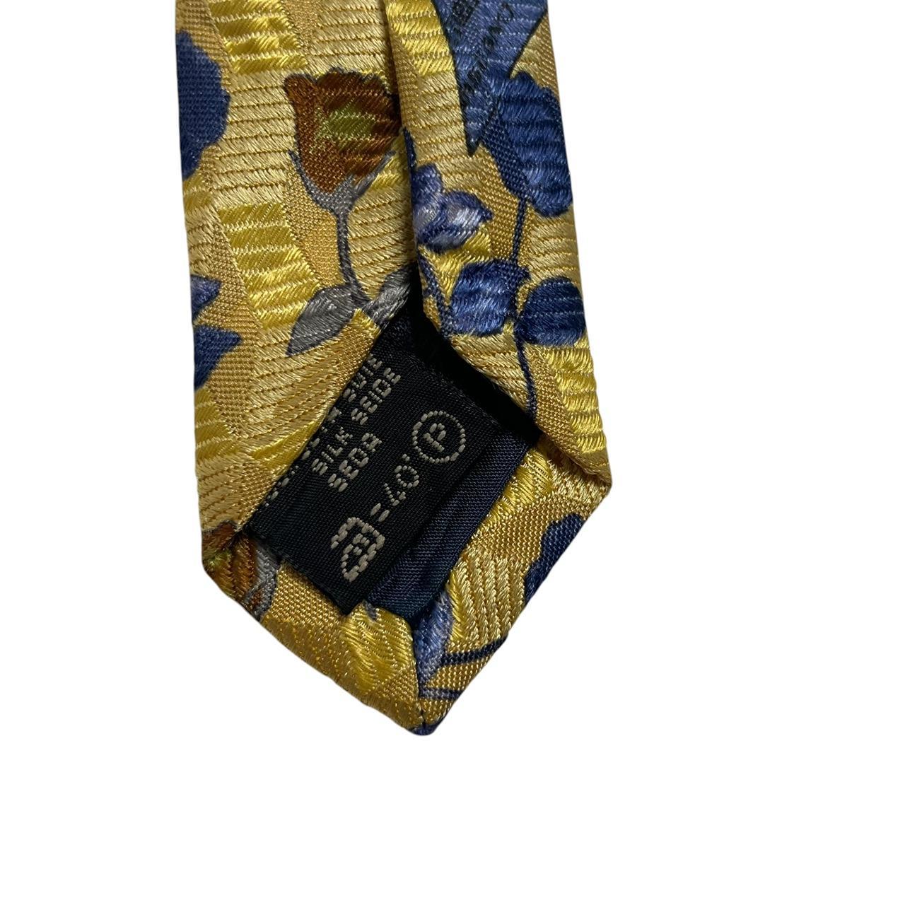 Ermenegildo Zegna yellow silk tie with floral pattern and logo detail.