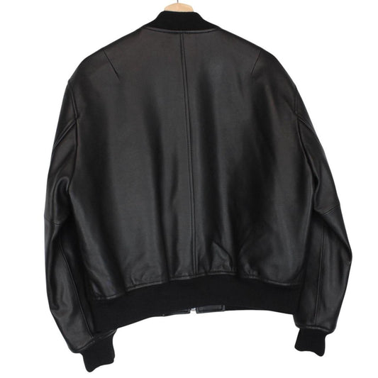 Coach black lamb leather bomber jacket with full zip and brand logo.