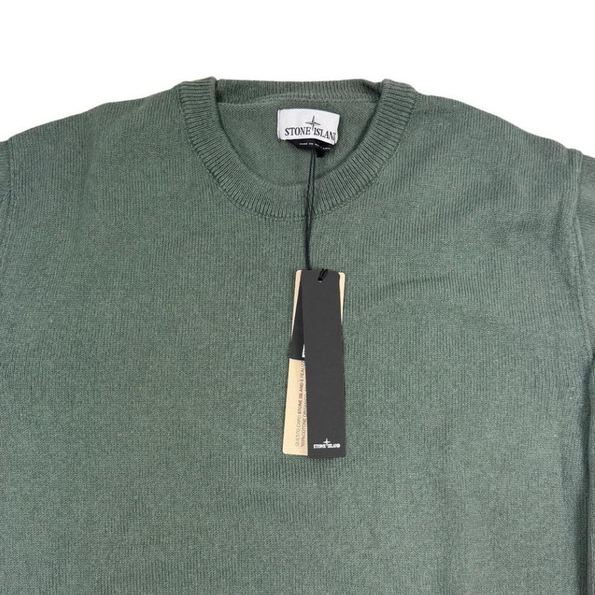 Stone Island green knit jumper made from organic cotton with logo patch detail.