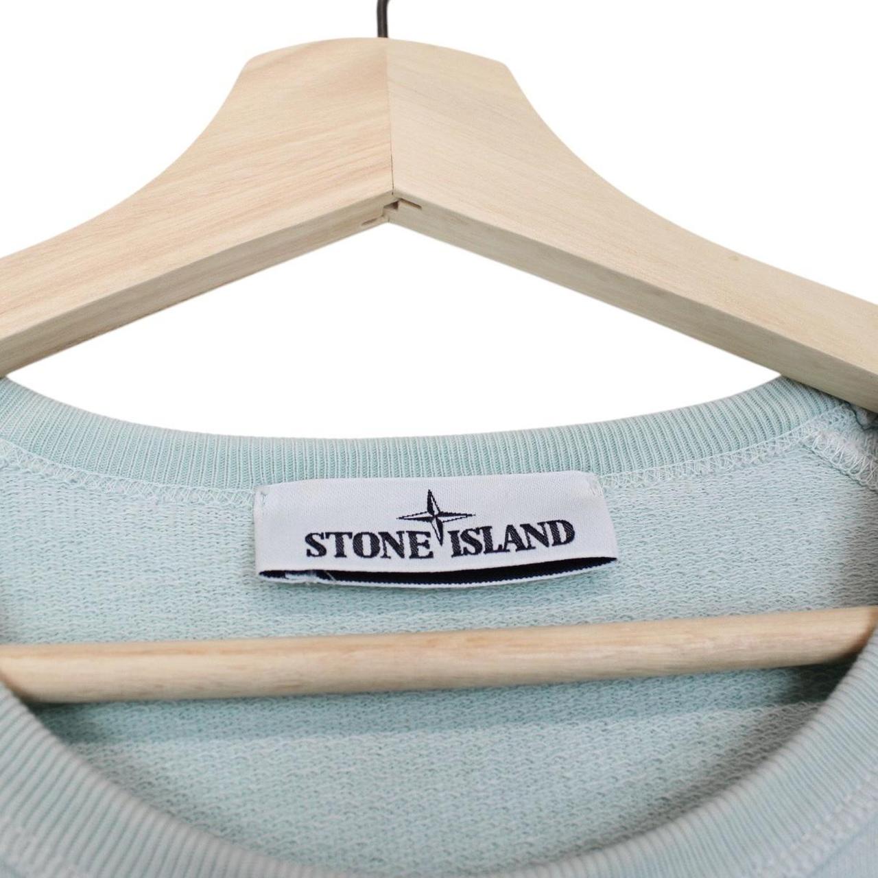 Stone Island mint green cotton sweatshirt with logo patch and ribbed cuffs.