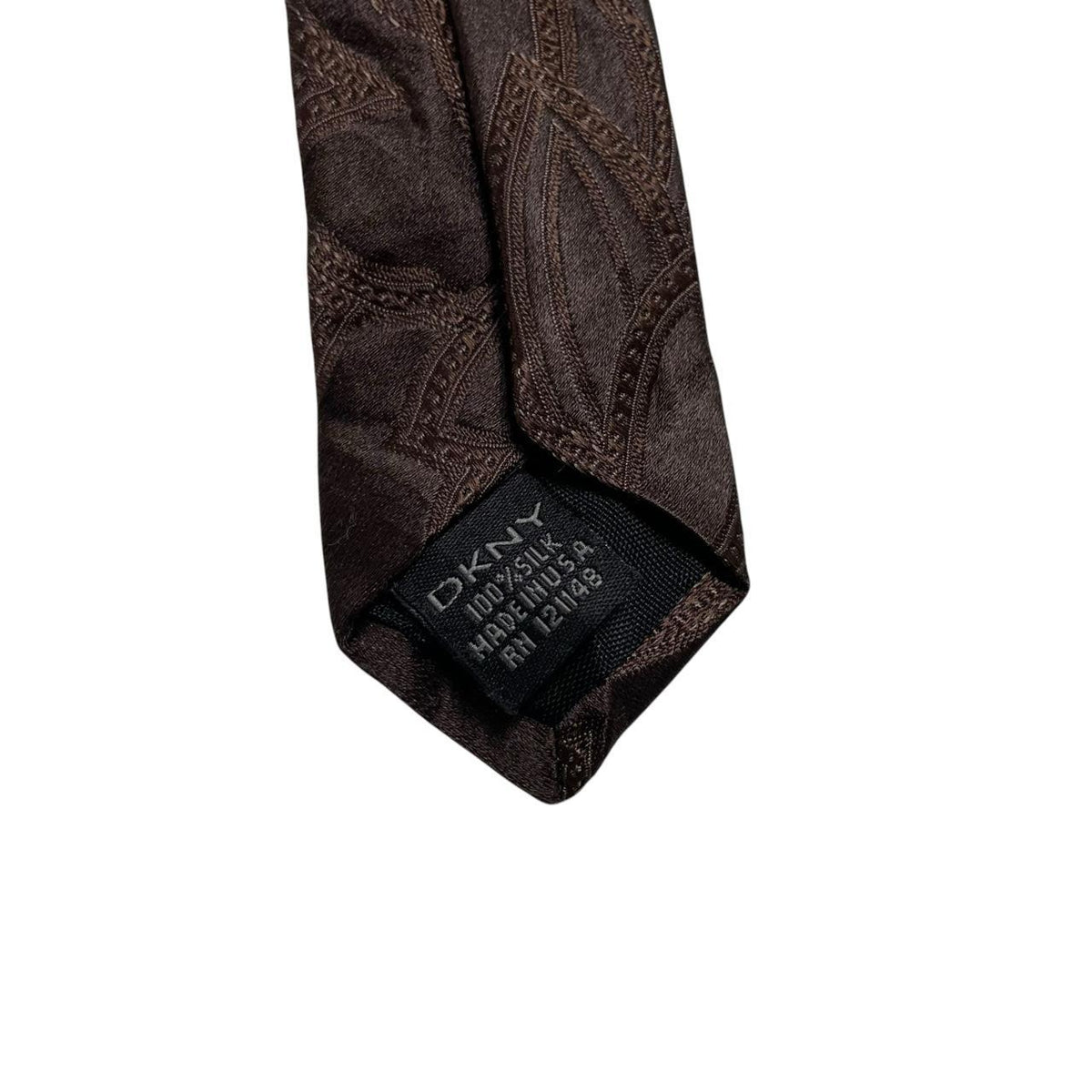DKNY brown silk tie with vintage floral pattern and logo detail.