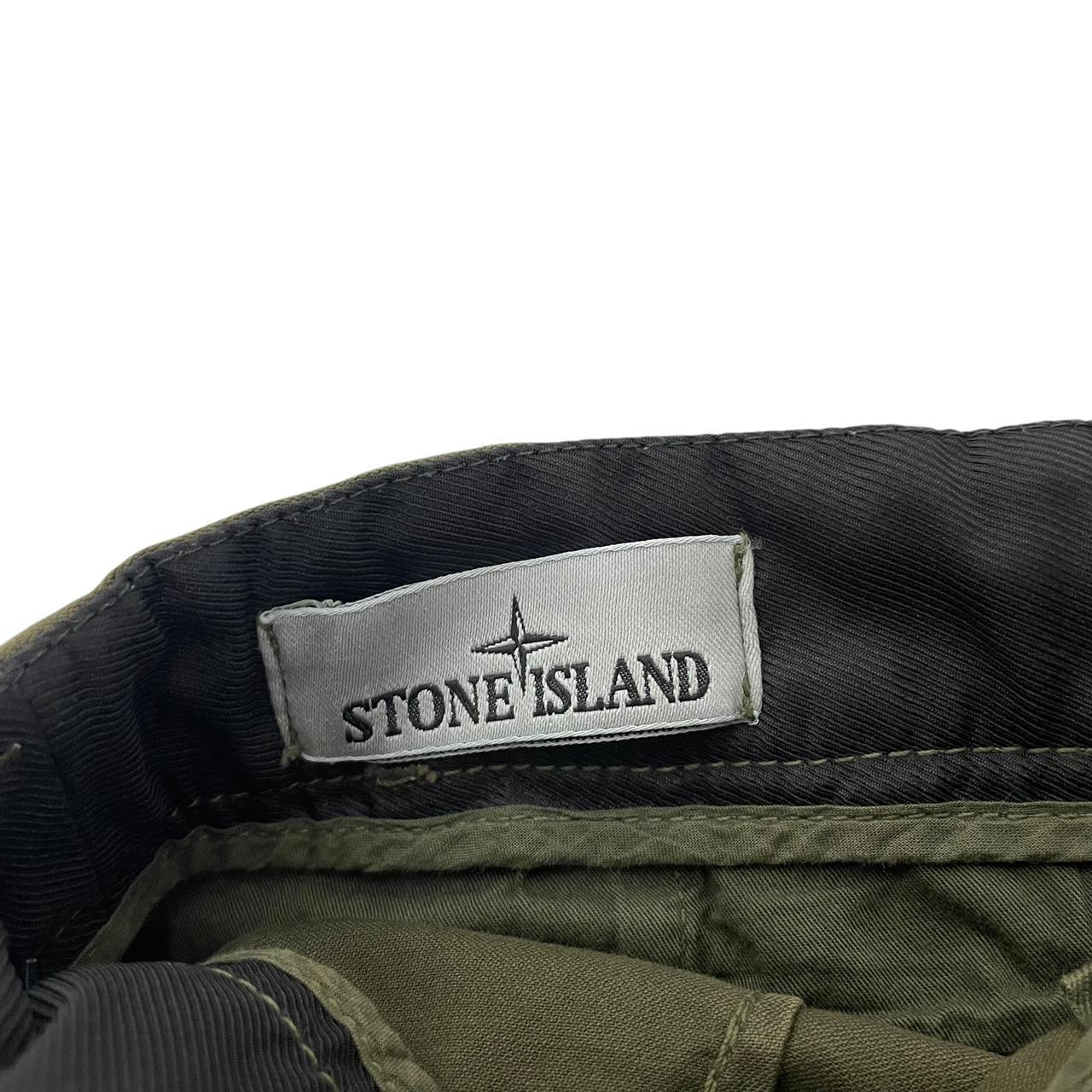 Stone Island khaki green skinny fit cargo trousers with logo patch and pockets.