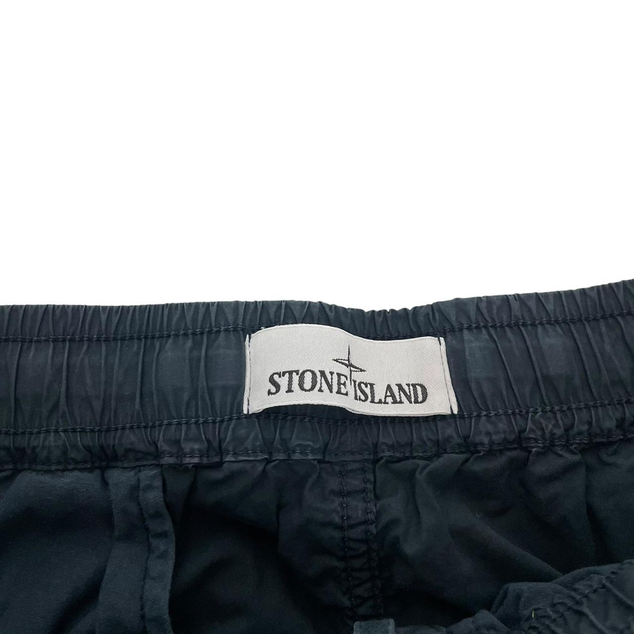 Stone Island navy blue cargo trousers with logo patch and multiple pockets.