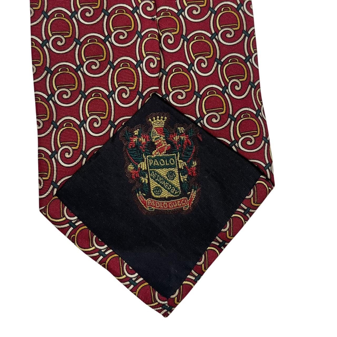 Gucci burgundy silk tie with vintage pattern and signature logo detail.