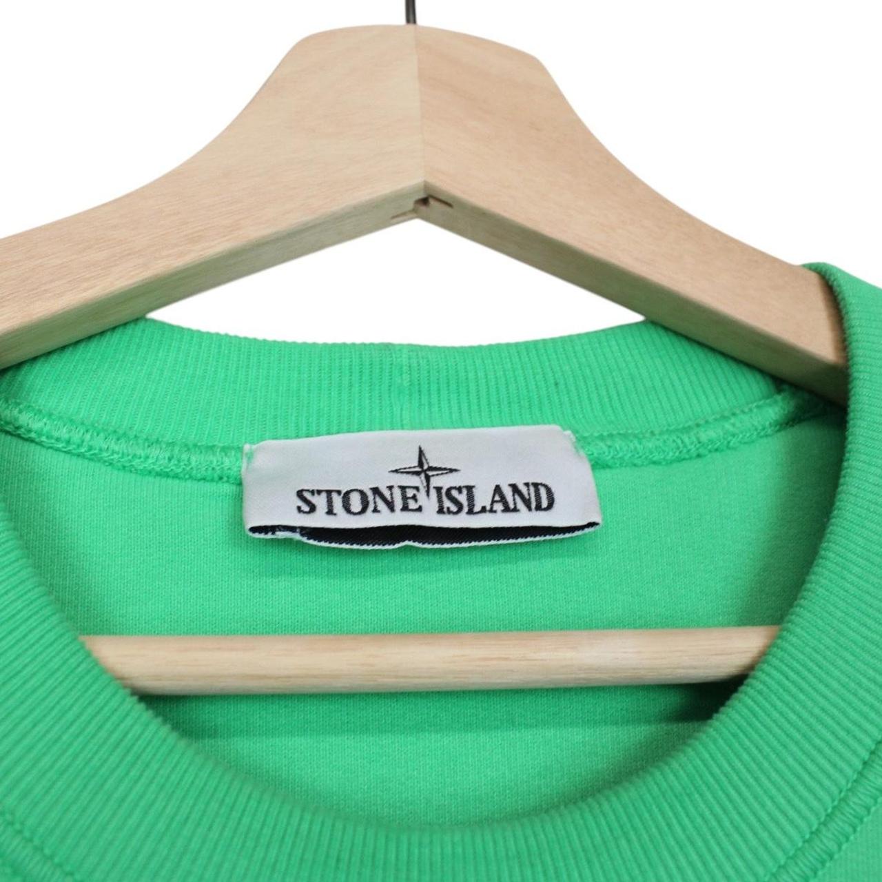 Stone Island green cotton sweatshirt with iconic compass logo and ribbed cuffs.