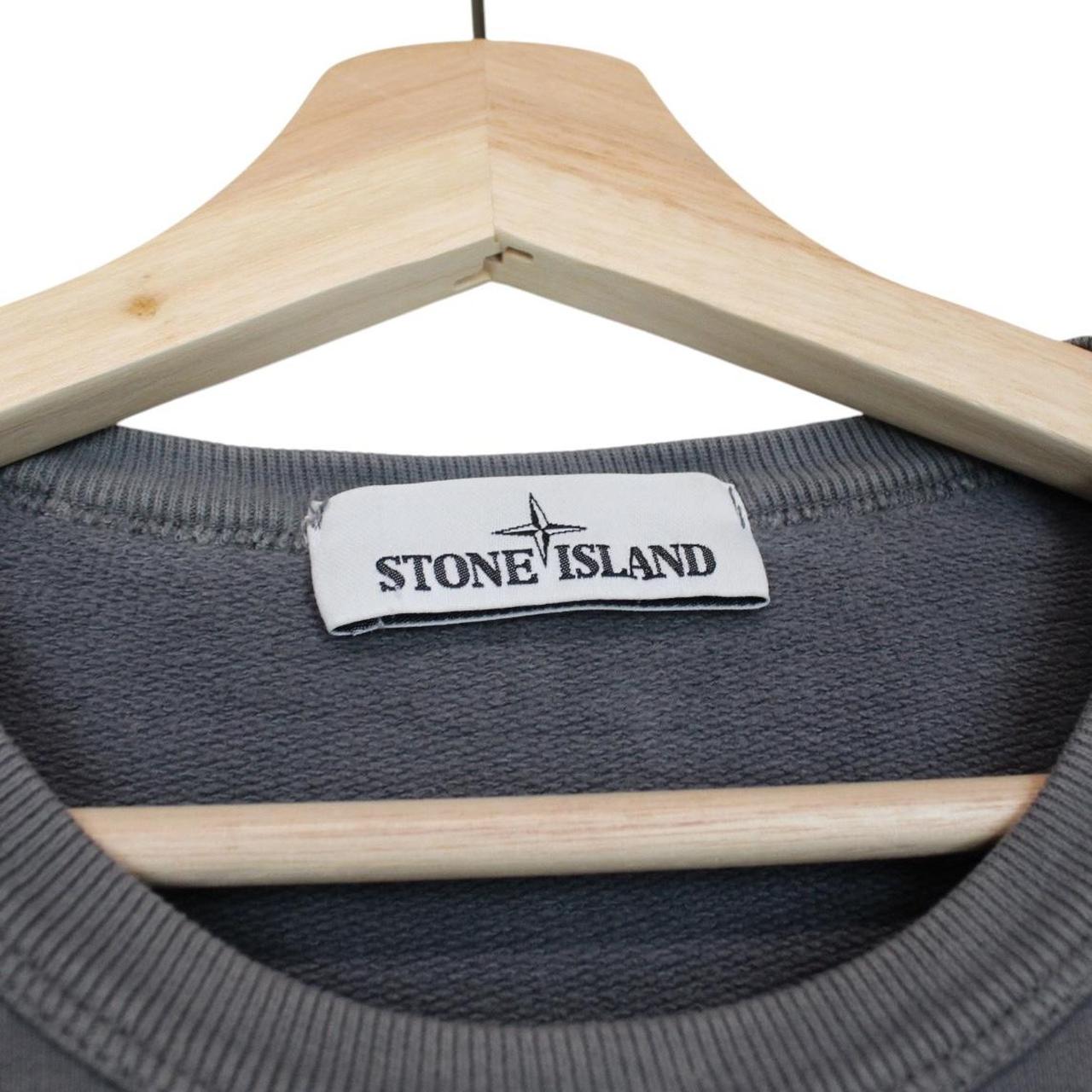 Stone Island grey cotton sweatshirt with embroidered compass logo and slight discolouration.