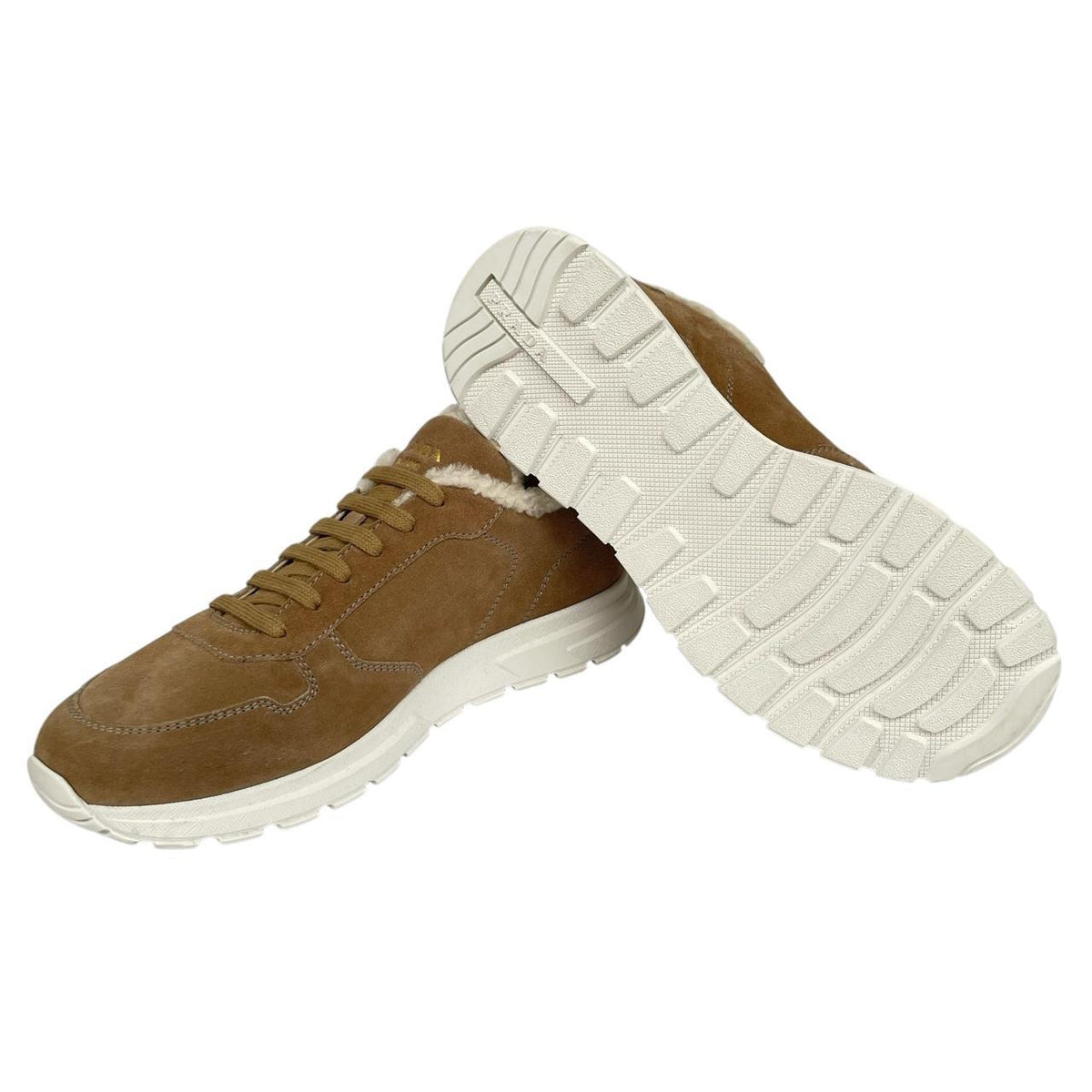 Prada brown suede trainers with shearling lining and logo detail.