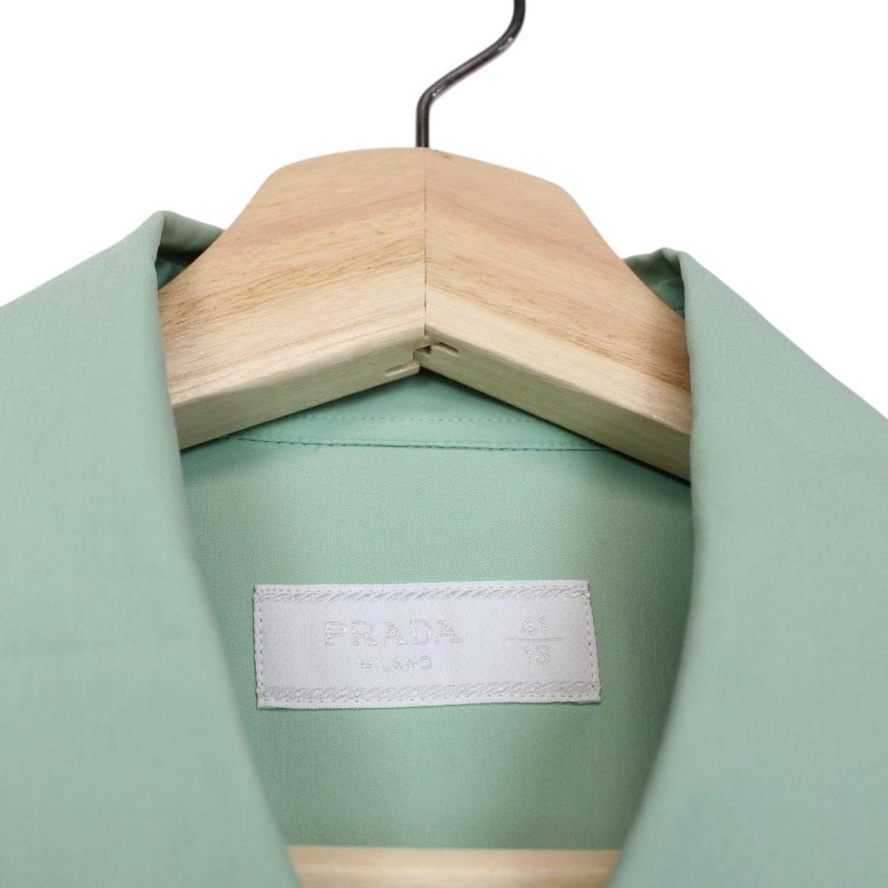 Prada green long sleeve shirt with popeline stretch fabric and logo detail.