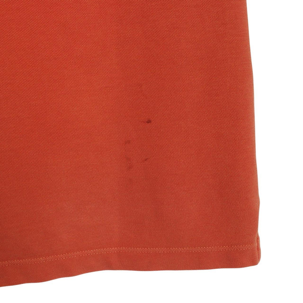 Stone Island orange short sleeve polo shirt with compass logo and cotton material.