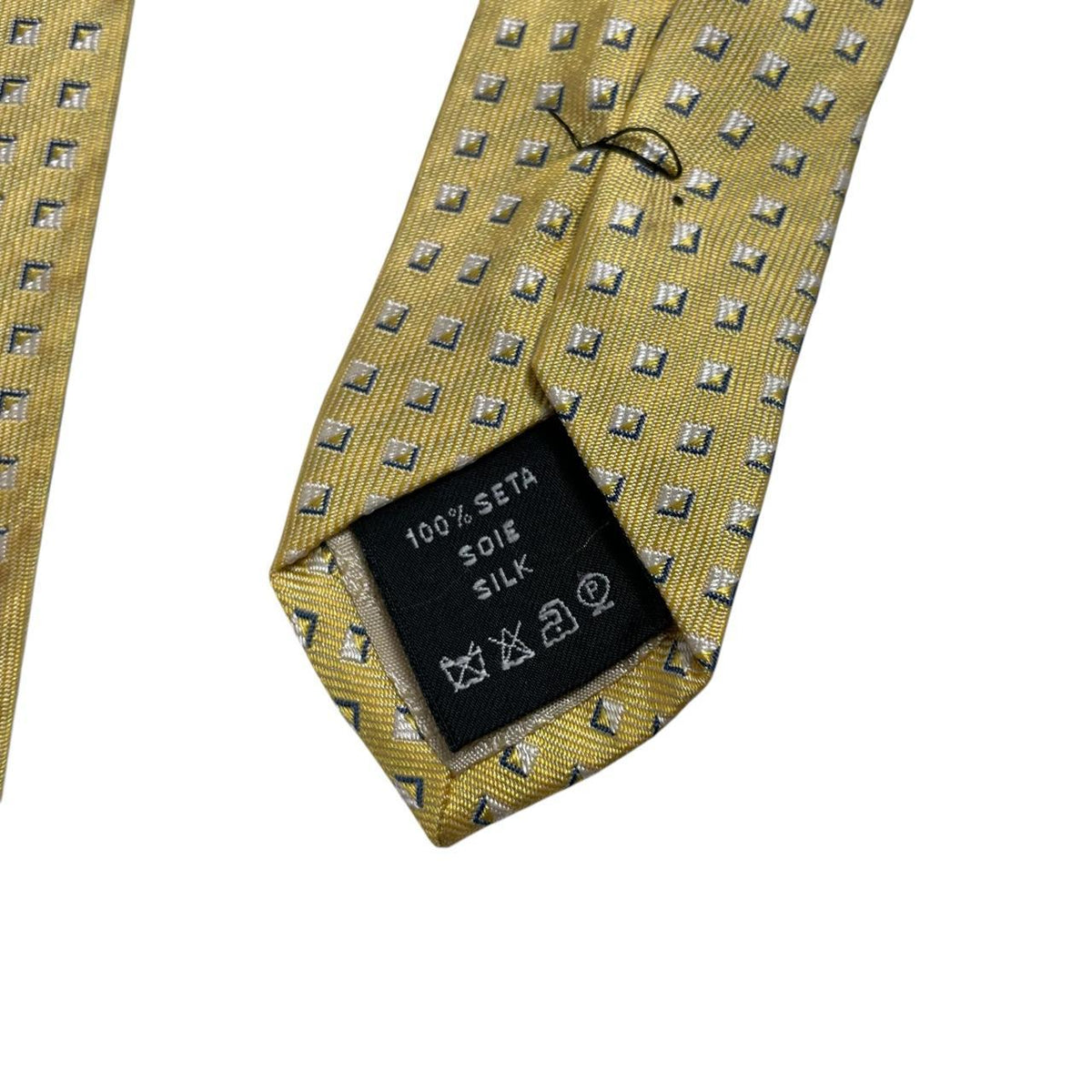 Versace yellow silk tie with subtle pattern and faint mark on front.