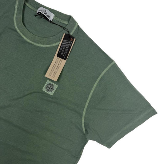 Stone Island green pocket t-shirt with compass logo and fissato effect cotton texture.