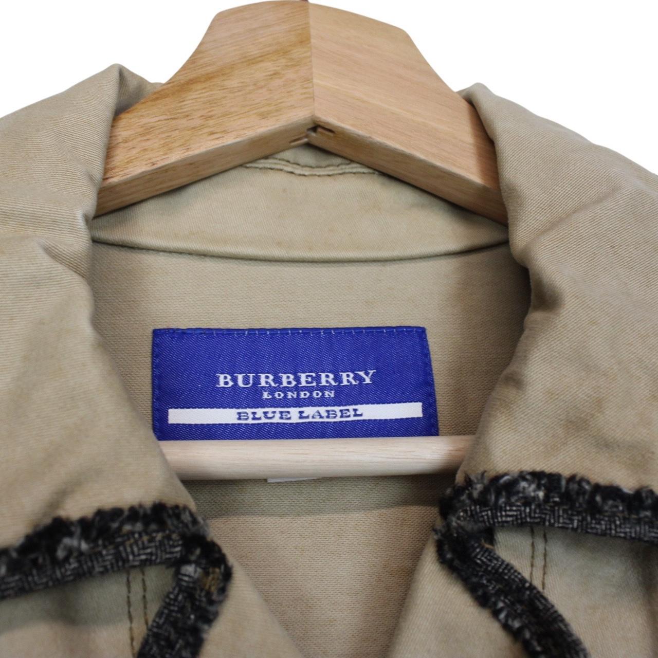 Burberry tan brown denim jacket with logo patch and visible stains, vintage style.