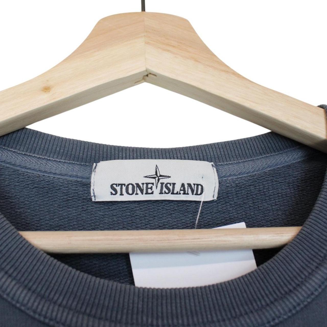Stone Island navy blue cotton sweatshirt with embroidered logo and ribbed cuffs.