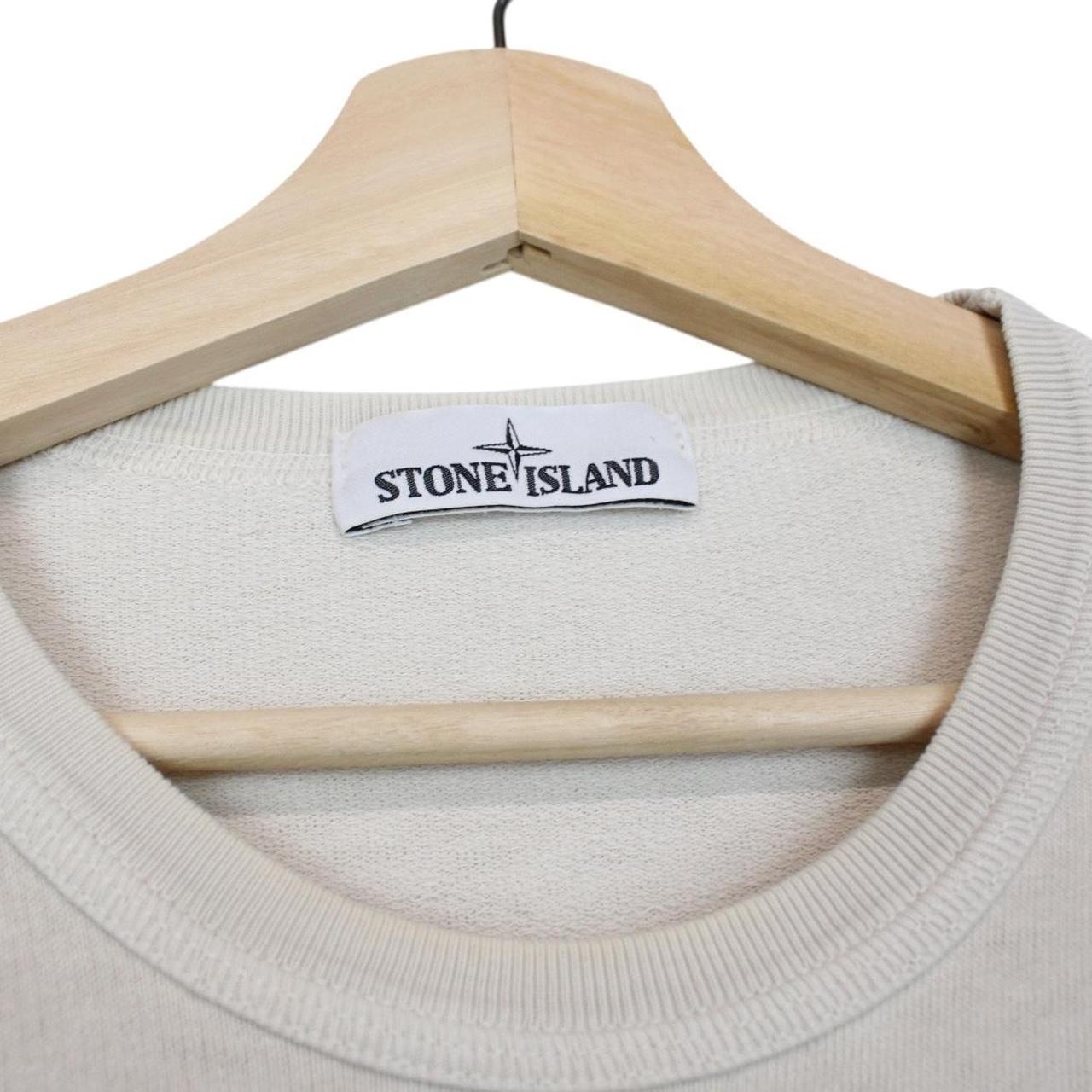 Stone Island beige cotton sweatshirt with logo patch and ribbed cuffs.