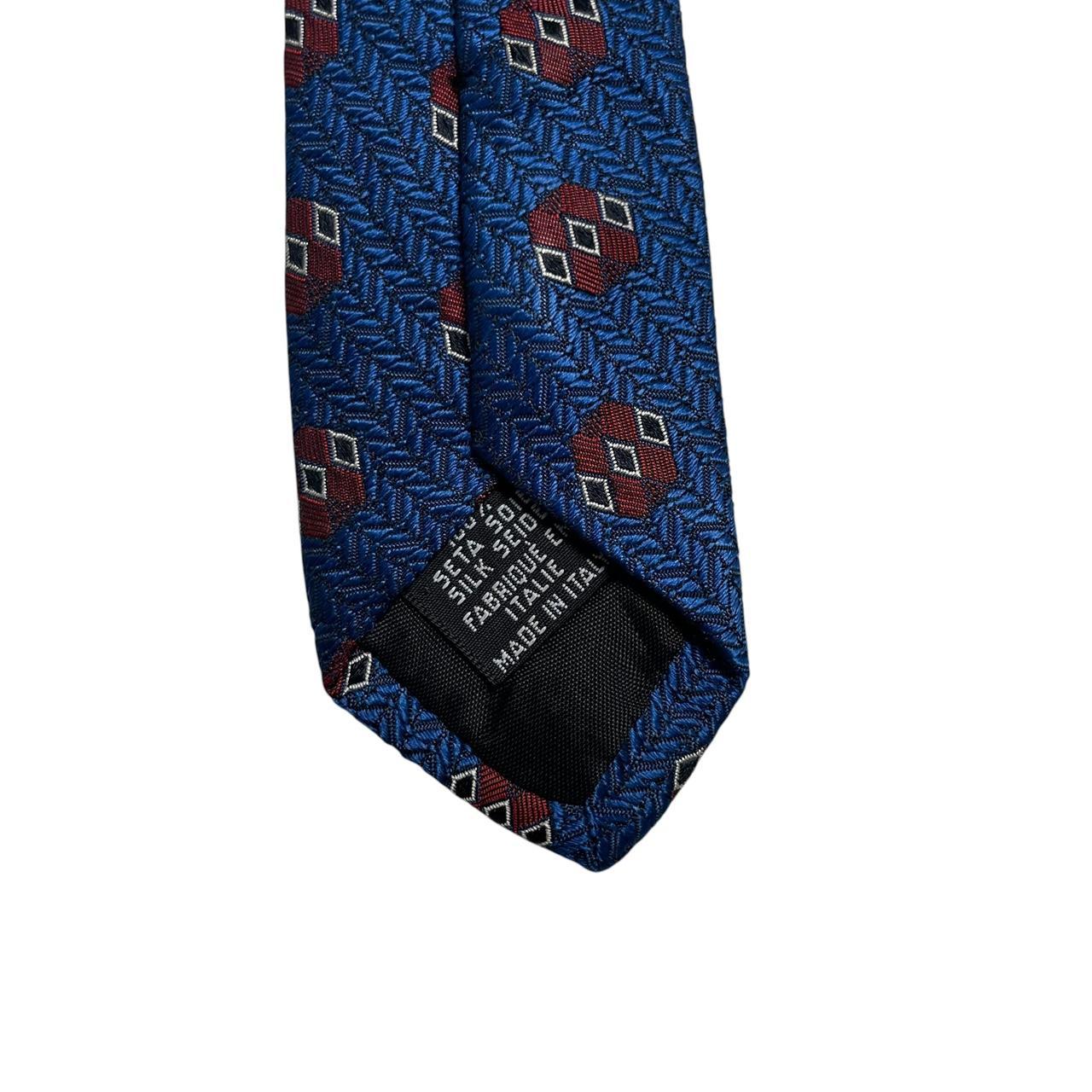 Hugo Boss blue silk tie with smooth texture and subtle sheen.