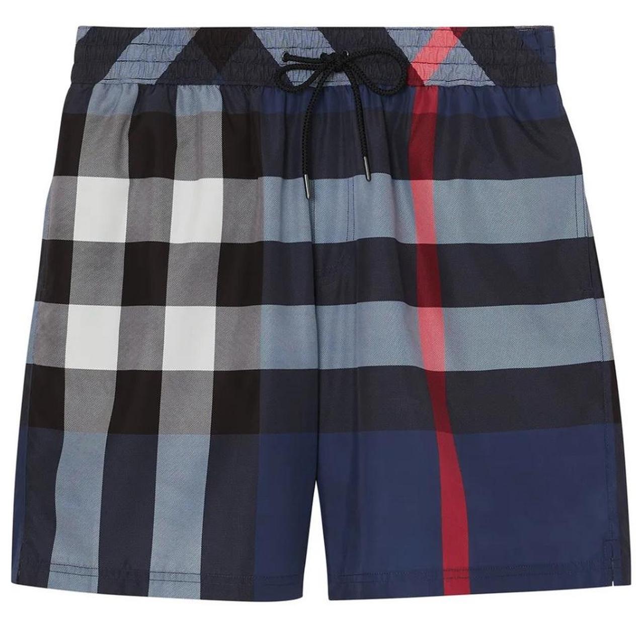 Burberry blue swim shorts with Nova Check pattern and logo detail.