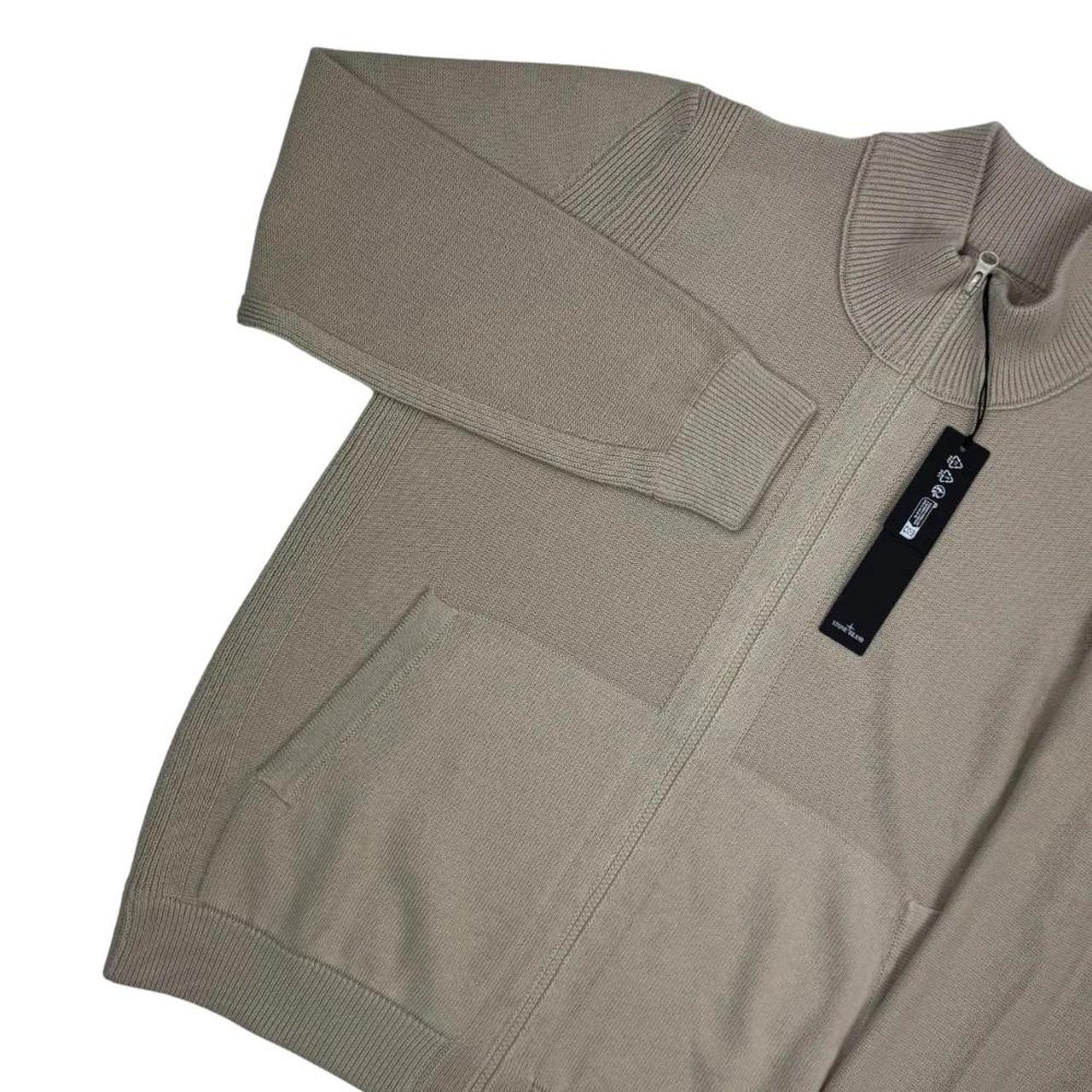 Stone Island beige knit jumper with stand collar, ribbed trims, and monochromatic badge.