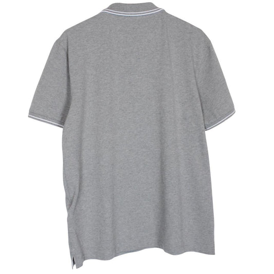 Stone Island grey polo shirt with embroidered compass logo and cotton material.