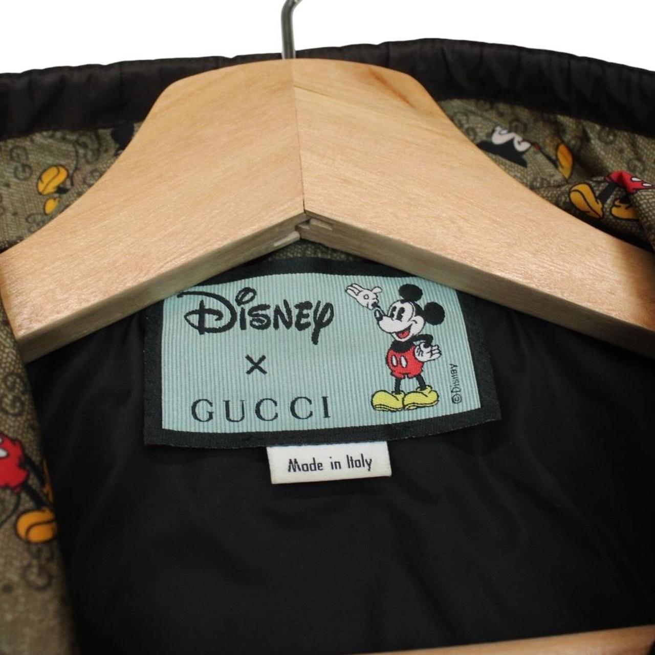 Gucci x Disney khaki brown windbreaker jacket with monogram pattern and nylon material.