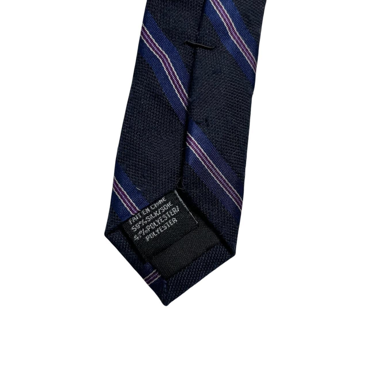 DKNY navy blue striped tie in silk/polyester blend with elegant sheen.