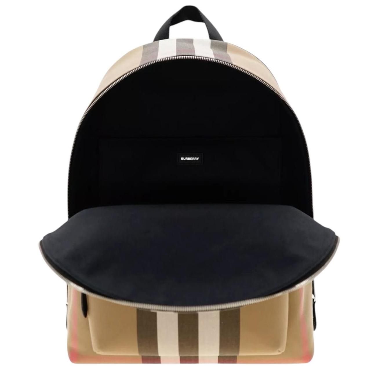 Burberry beige and black duffel bag with signature Nova Check pattern and logo.