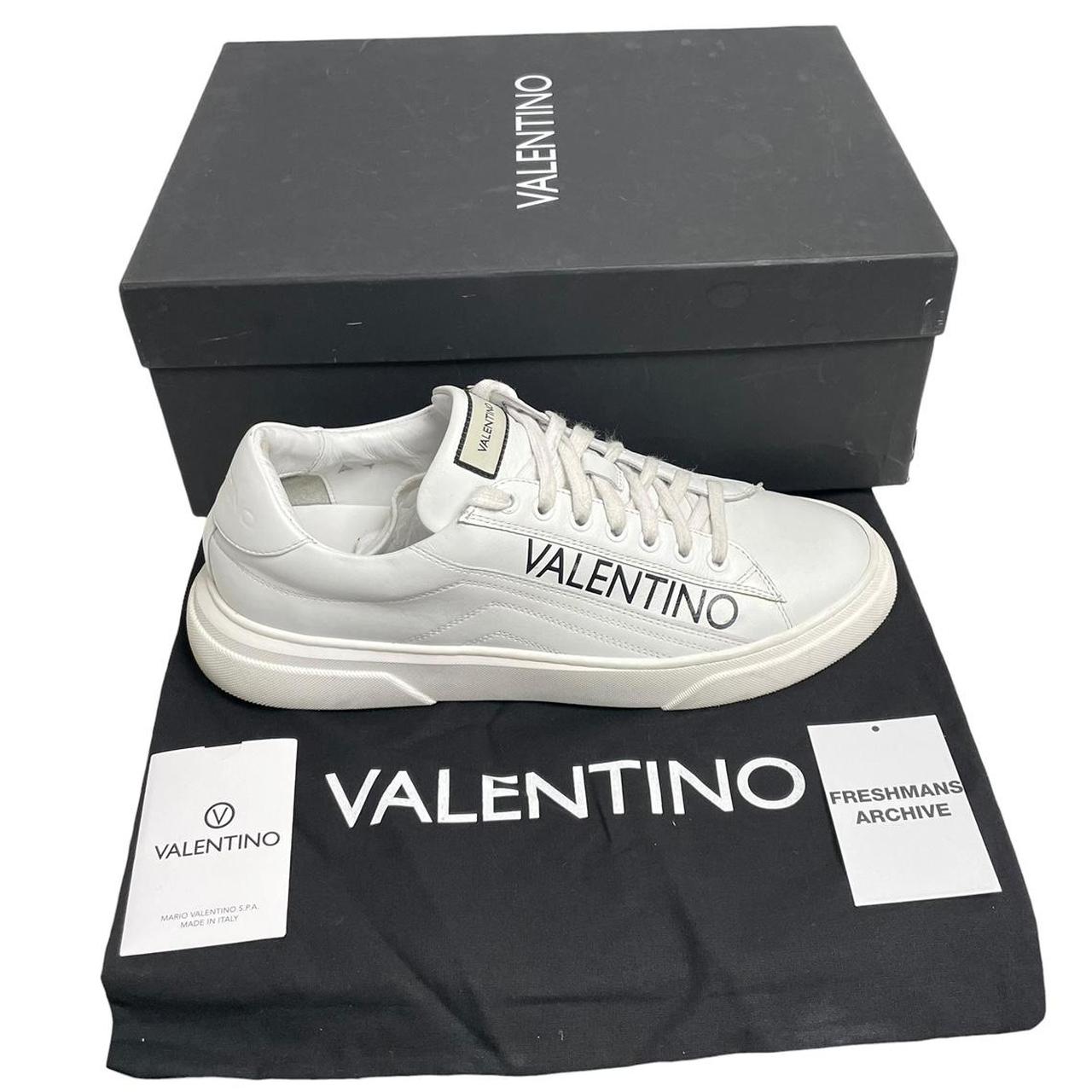 Valentino black and white trainers calfskin leather with logo detail and scuffed soles.