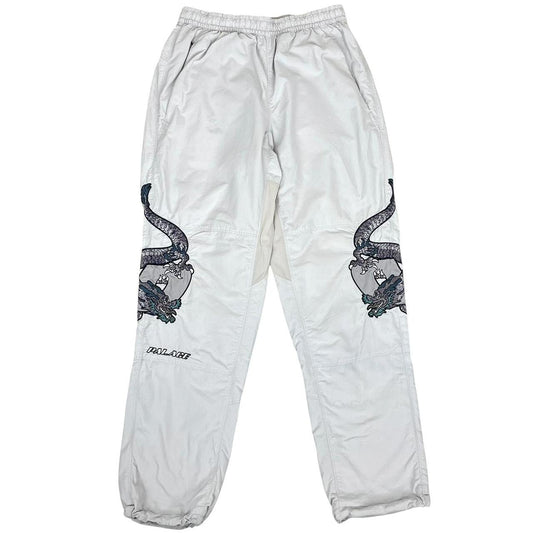 Palace grey joggers embroidered dragon design, made of nylon, size medium.