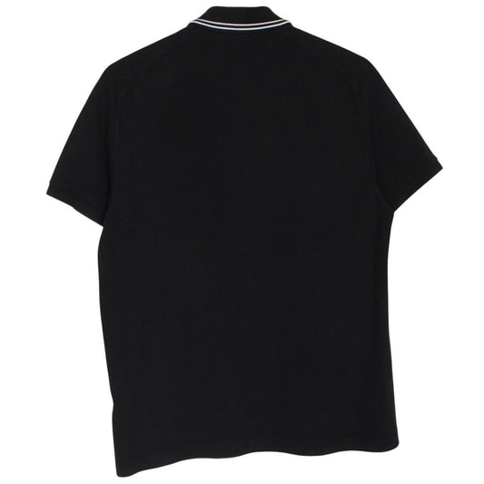 Stone Island black polo shirt with embroidered compass logo and cotton material.