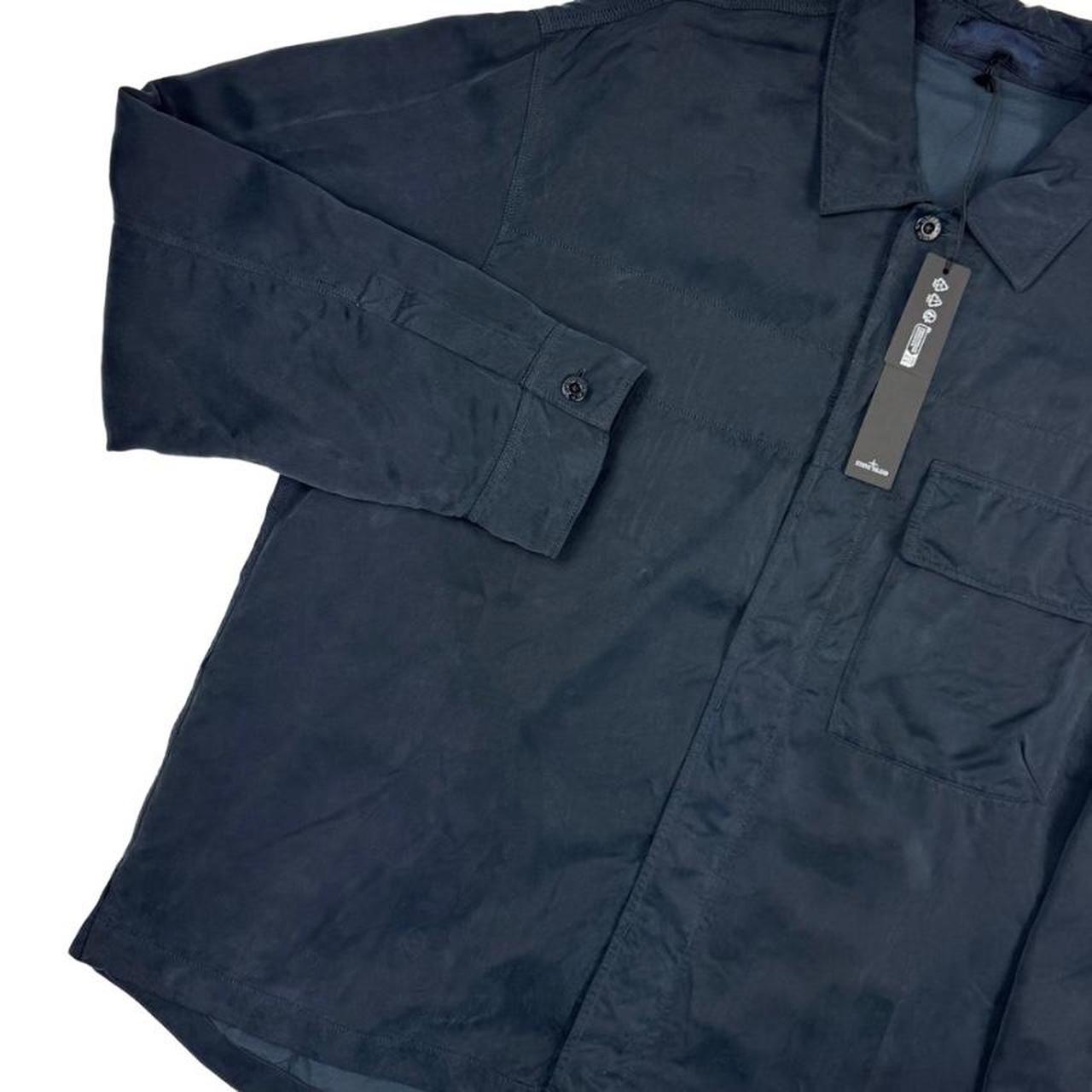 Stone Island navy blue overshirt jacket with flap pocket and monochrome logo patch.