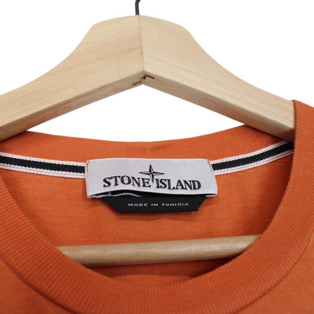 Stone Island orange short sleeve t-shirt with logo print and cotton material.