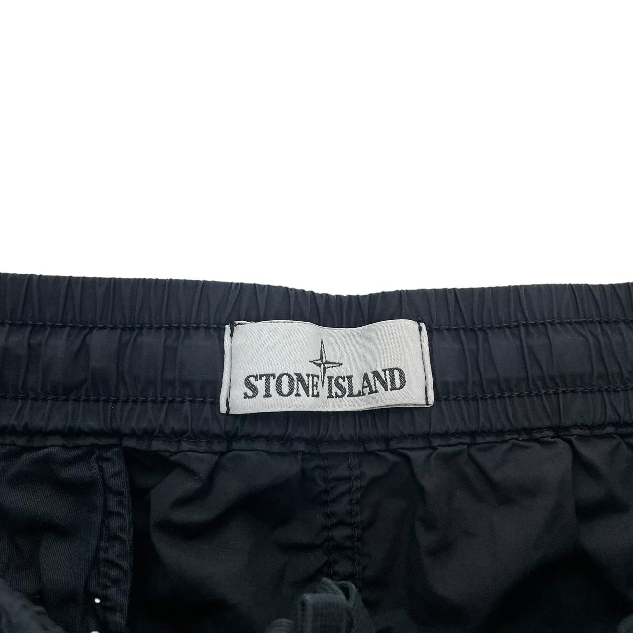 Stone Island navy blue cargo trousers with logo patch and RE-T fit design.