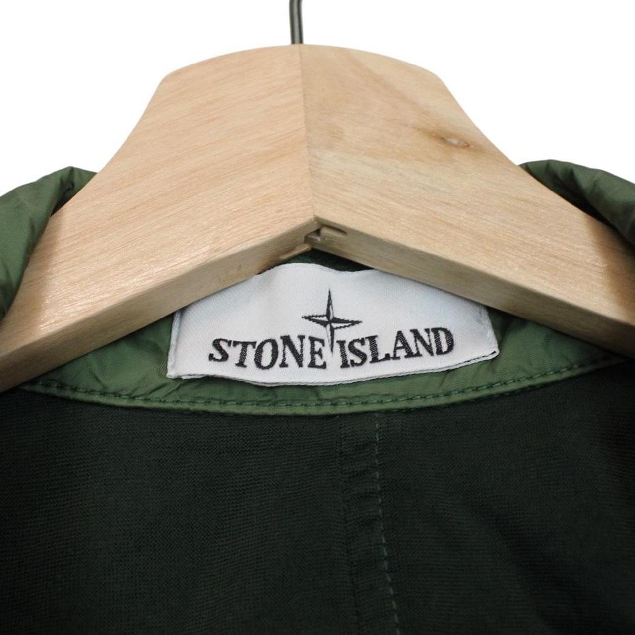 Stone Island green nylon overshirt jacket with full zip and compass logo patch.