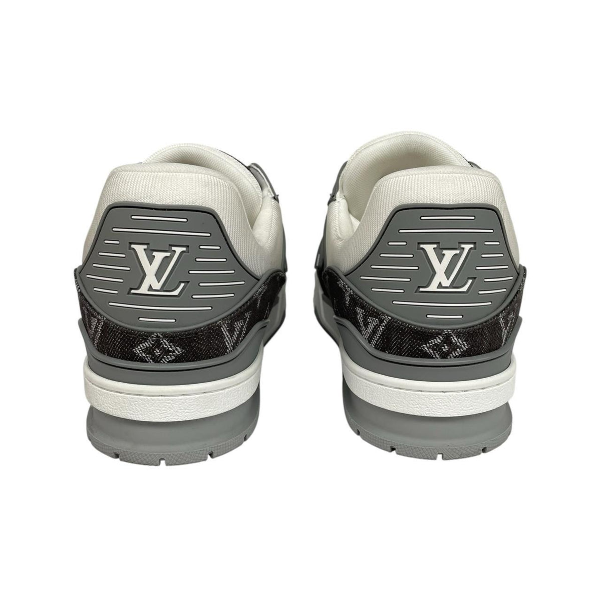 Louis Vuitton grey and white trainers with monogram pattern and leather accents.