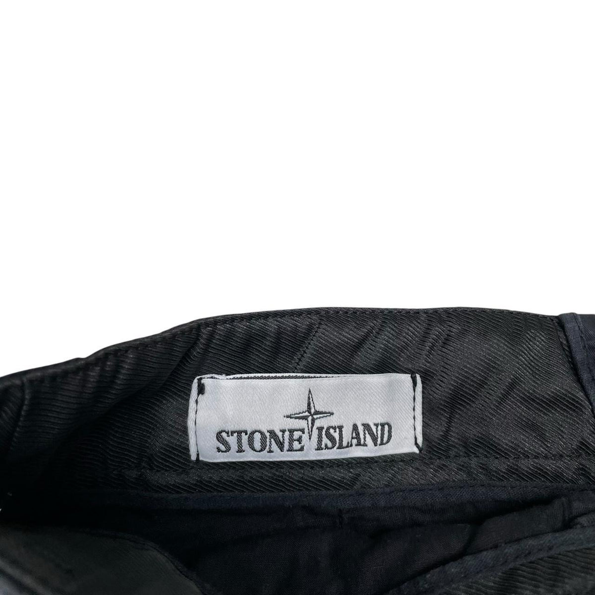 Stone Island navy blue cargo shorts with logo patch and faded cotton material.