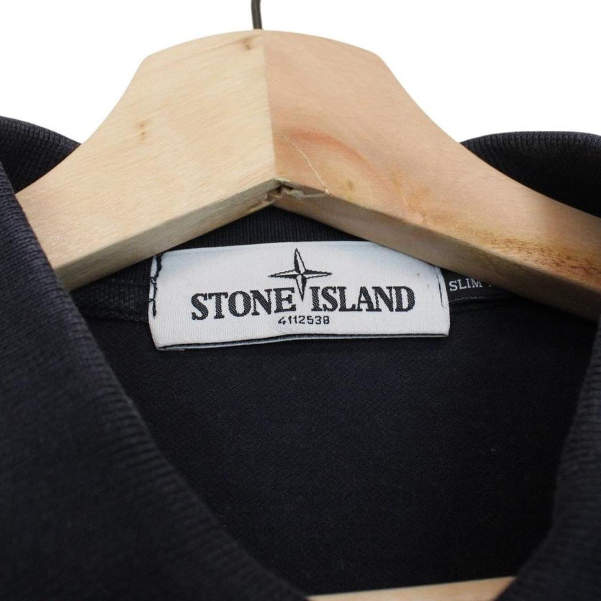 Stone Island navy blue short sleeve polo shirt with compass logo and cotton material.
