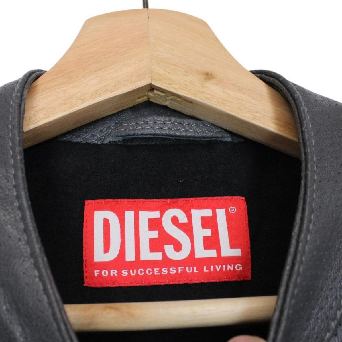 Diesel grey leather jacket with full zip and subtle logo detailing.