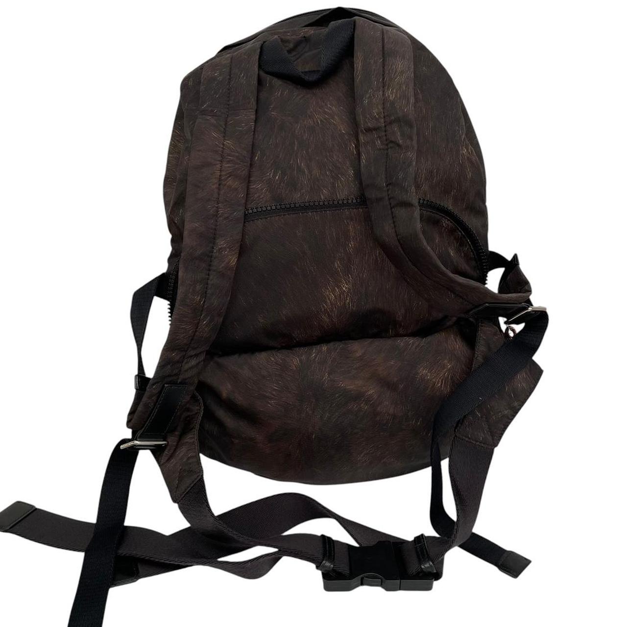 Burberry brown and black convertible bum bag with ape logo and durable material.