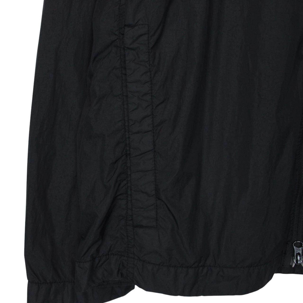 Stone Island black overshirt jacket with full zip, two zipped pockets, and snap button cuffs.