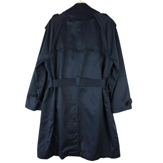 Burberry navy blue double breasted trench coat with belted waist and classic check lining.